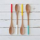 Paint dipped wooden spoon bright colours